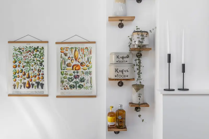 Vintage botanical prints and a spice shelf in the kitchen