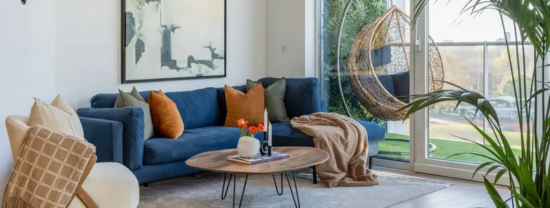 Wide view of the penthouse living area opening onto the terrace