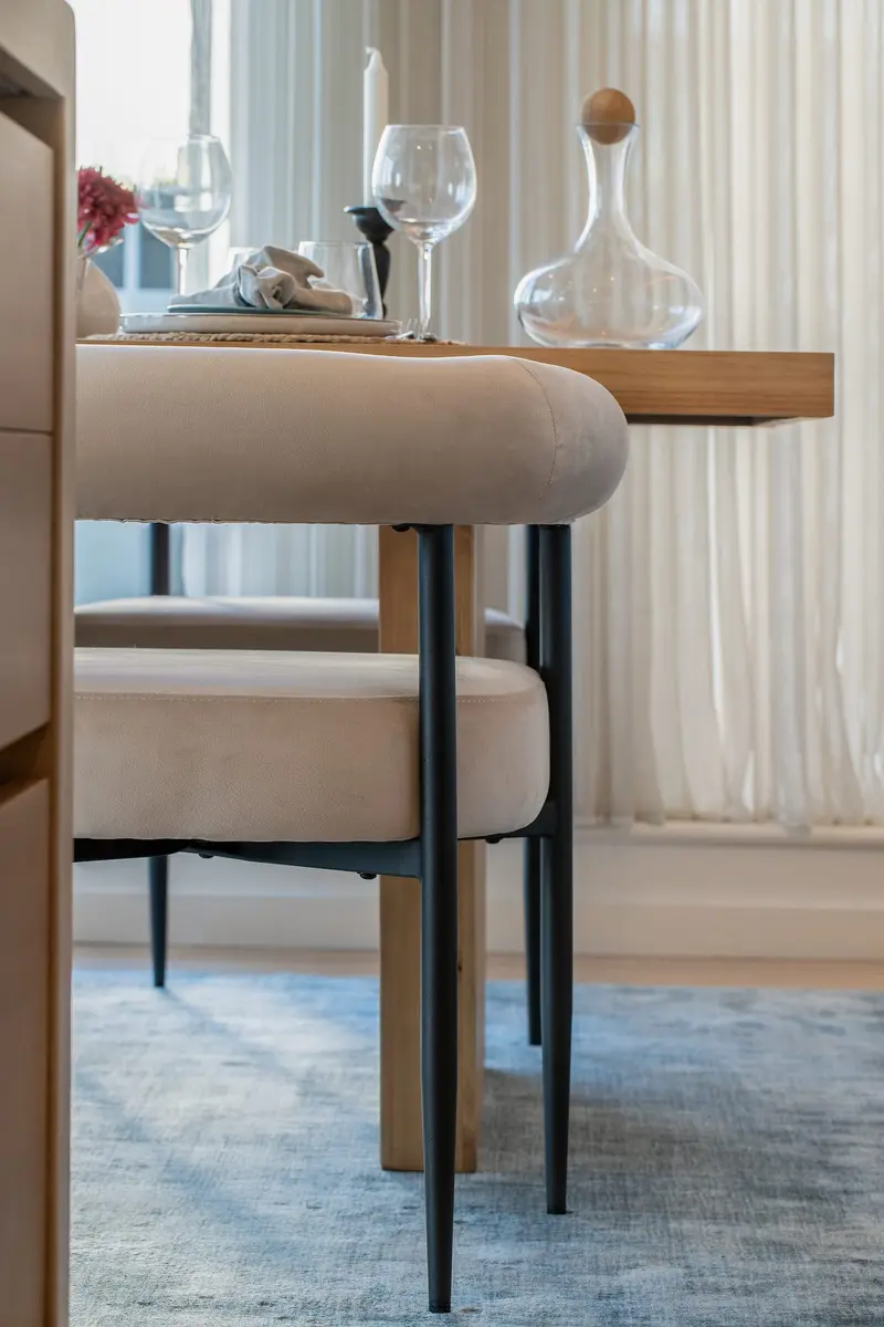 Upholstered dining chairs and styled sideboard