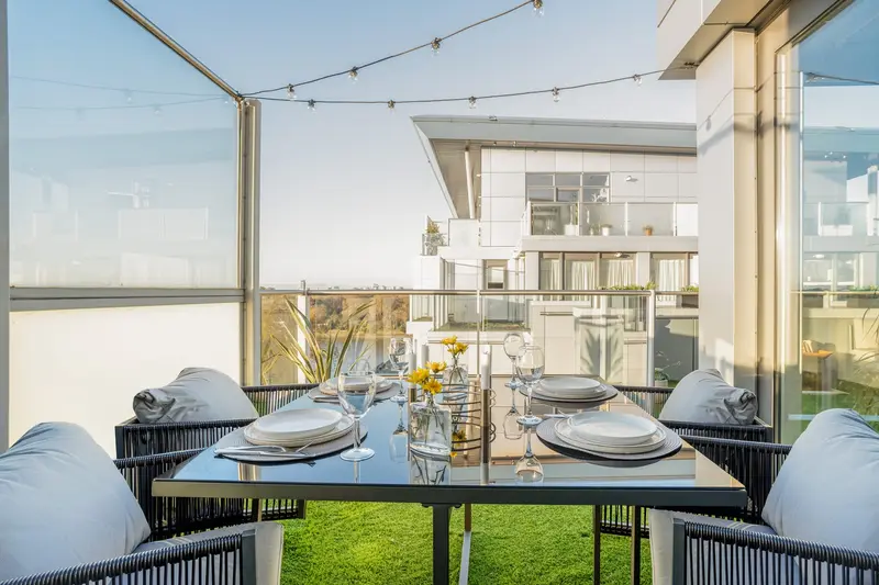 Outdoor dining under festoon lights on the terrace