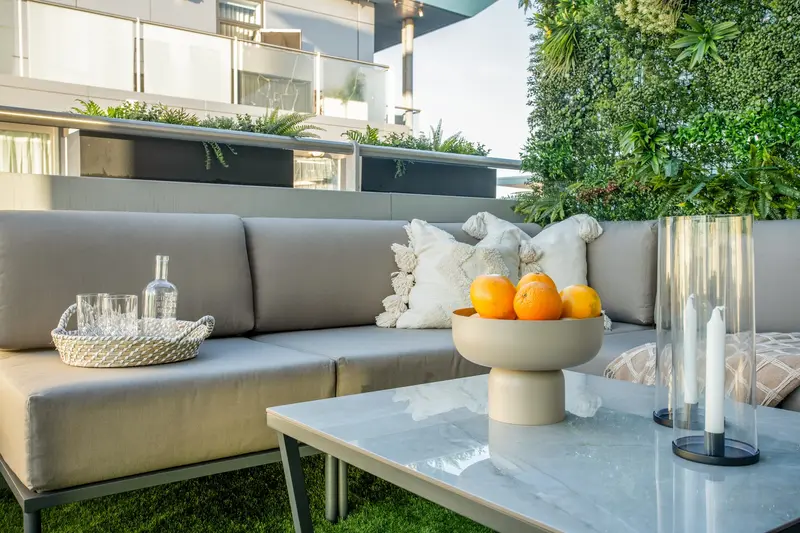 Terrace coffee table with a bowl of oranges