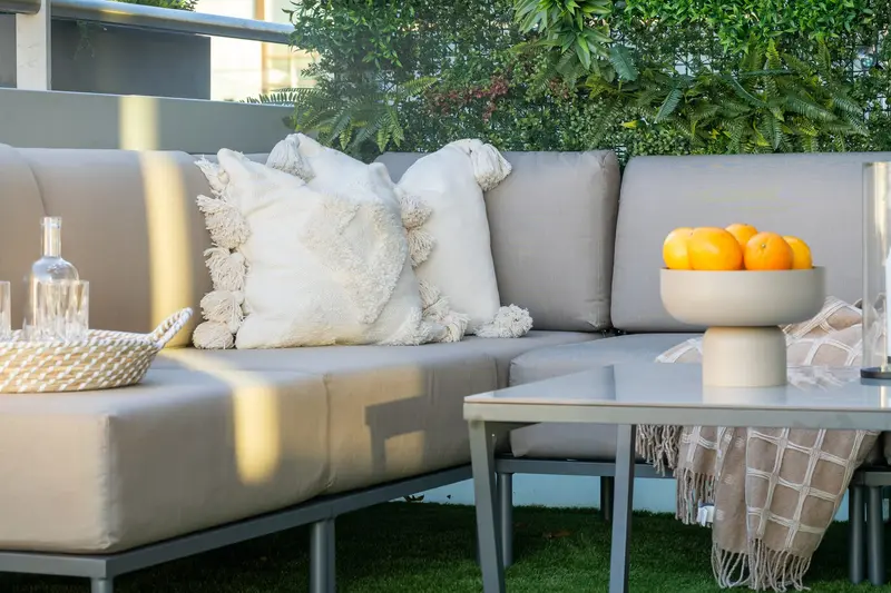 Terrace corner sofa with textured cushions