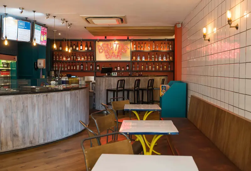 Benitos dining area with painted tiles and bar