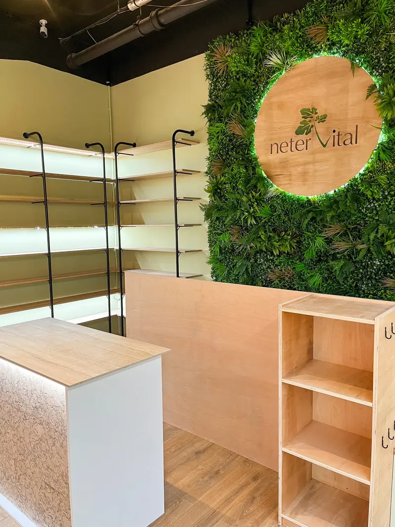 Till desk beneath the moss wall logo