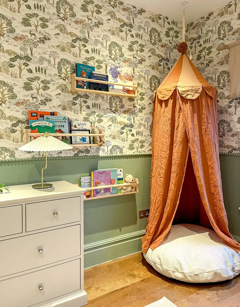 Reading corner with a rust canopy and floor cushion