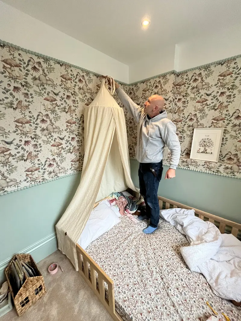 Nursery wallpaper going up during the Edwardian house renovation