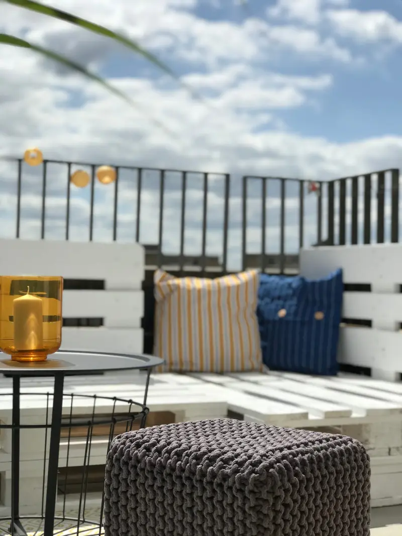 Pallet sofa with cushions on the office terrace