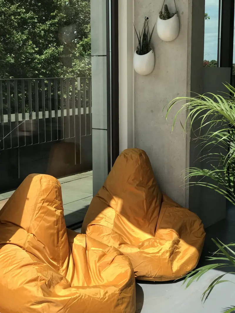 Mustard bean bags in the breakout corner