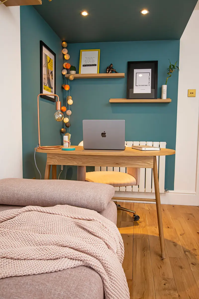 Teal meditation and home office nook with a wooden desk