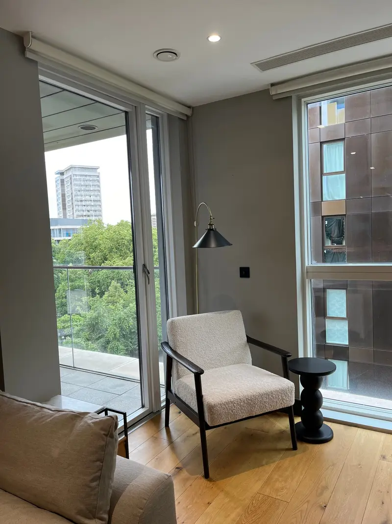 Reading chair by tall windows