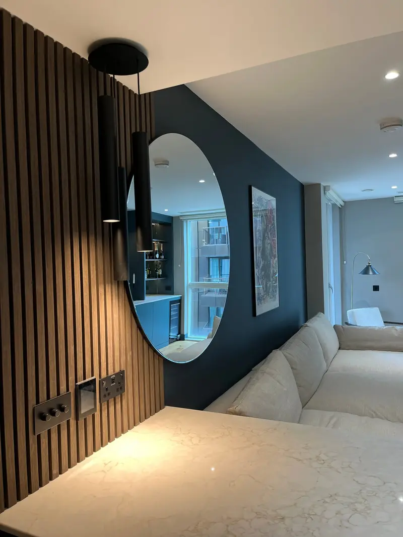 Wood slat panelling with a black wall light