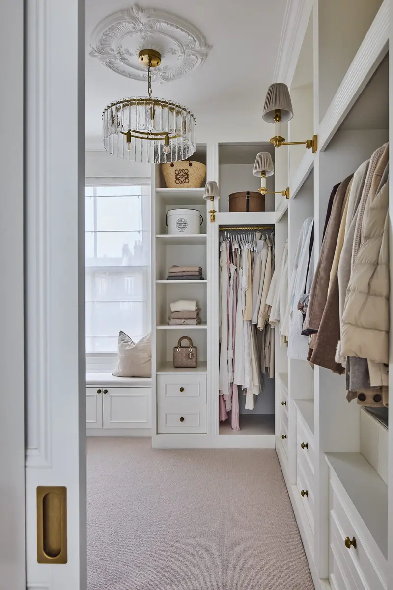 Walk-in dressing room with open hanging rails and shelving