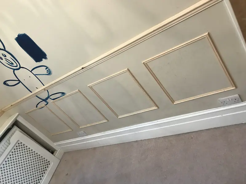 Rectangle moulding and dado rail being fitted